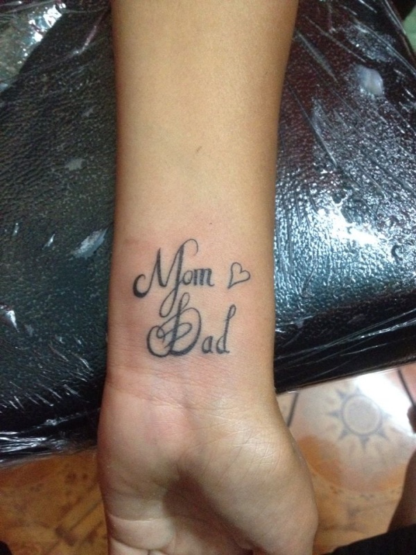 Mom and Dad thumb tattoo